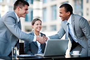 Young business people making a business deal.